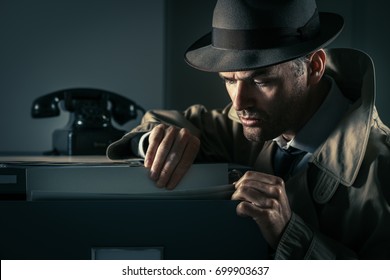 Vintage undercover criminal spy stealing files in a filing cabinet late at night, security and data theft concept