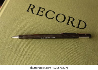 Vintage US Government Pencil And Record Book, Angled Shot.