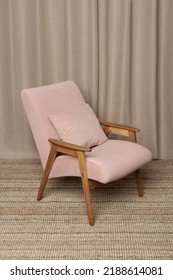 Vintage Velvet Pink Armchair With Pillow Standing On The Flaxen Rug On A Background Of Linen Texture Curtains. Interior. Home Decor. Redesign Furniture.