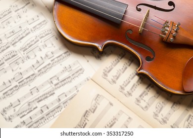 Vintage violin on the  sheet music.