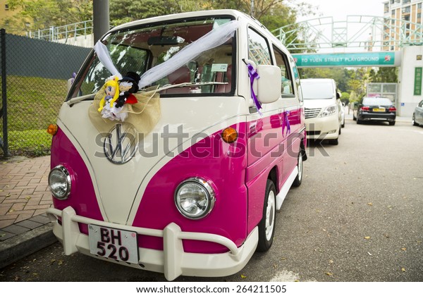 VINTAGE VOLKSWAGEN WEDDING CAR, HONG KONG - MAR\
14: The vintage Volkswagen wedding car in Hong Kong on March 14,\
2014. There are also a pair of dolls which is symbolic to the newly\
married couple.