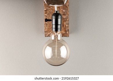 Vintage Wall Lamp To Illuminate The Terrace. Antique Lamp With Edison Bulb. The Concept Of Saving Energy Or Lack Of Ideas. Turned Off Lamp On A Light Background.