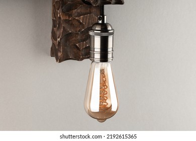 Vintage Wall Lamp To Illuminate The Terrace. Antique Lamp With Edison Bulb. The Concept Of Saving Energy Or Lack Of Ideas. Turned Off Lamp On A Light Background.