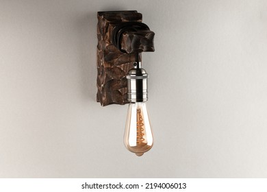 Vintage Wall Lamp To Illuminate The Terrace. Antique Lamp With Edison Bulb. The Concept Of Saving Energy Or Lack Of Ideas. Turned Off Lamp On A Light Background.