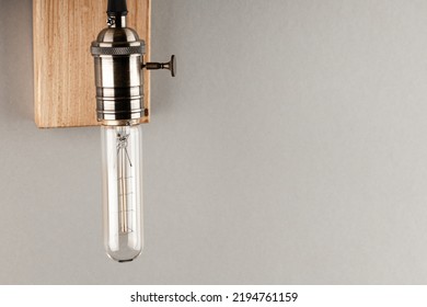 Vintage Wall Lamp To Illuminate The Terrace. Antique Lamp With Edison Bulb. The Concept Of Saving Energy Or Lack Of Ideas. Turned Off Lamp On A Light Background.