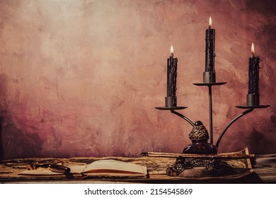 Vintage wallpaper with copy space. Antique desk with clock, inkwell and pen and candlestick.