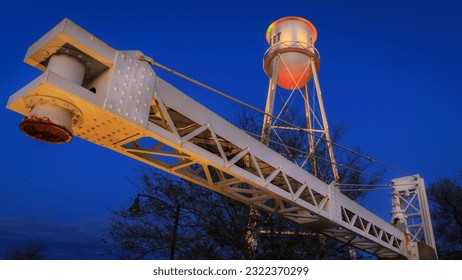 Vintage Water Tower and other Structures in the Downtown Water Tower Plaza Park of Gilbert Arizona at blue hour