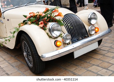 Vintage Wedding Car Decorated with Flowers.