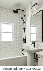 Vintage White Bathroom with Pedestal Sink and Subway Tile and Black Matte Fixtures