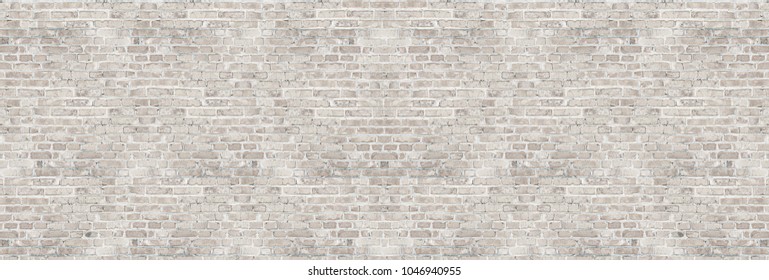 Vintage white wash brick wall texture for design. Panoramic background for your text or image.