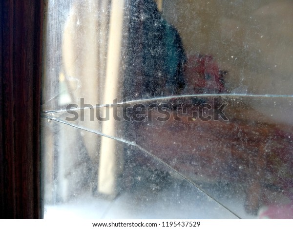 vintage  window / door and broken glass.\
Old wood windows / door with broken glass. broken glass patterns.\
old window / door with grill and wood\
frame.