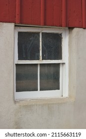 Vintage Window On A Red Barn Wall.