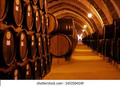 Vintage wine cellar with old oak barrels, production of fortified dry or sweet tasty marsala wine in Marsala, Sicily, Italy