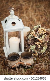 Vintage Winter Floral Composition With Lantern, Candle, Bouquet And 2 Cups Of Tea. Wedding Ceremony And Decorations. Simple Wedding. Big Day For A Couple In A Small Venue