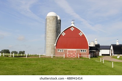 Vintage Wisconsin Dairy Farm With Traditional Red Barn And Silo's