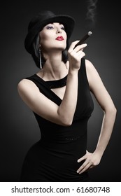 A Vintage Woman Smoking A Cigar Isolated On Dark Background