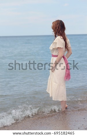 vintage woman wadding in the sea