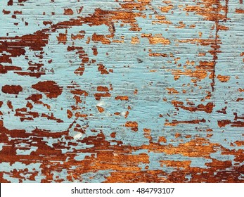 Vintage wood background with peeling paint . nail holes