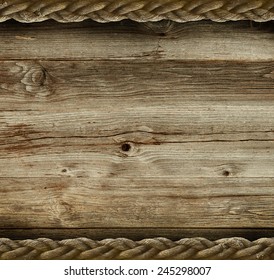 Vintage wooden background with the old rope