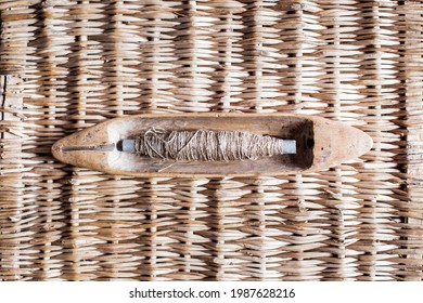 vintage wooden boat shuttles for hand weaving. The weft yarn is unwound from the tip of the pier when the shuttle is in motion and stops when the shuttle stops. spindle, manual spinning, loom