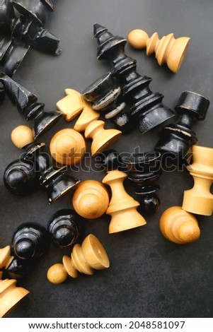 Vintage wooden chess pieces on dark background. Flat lay.