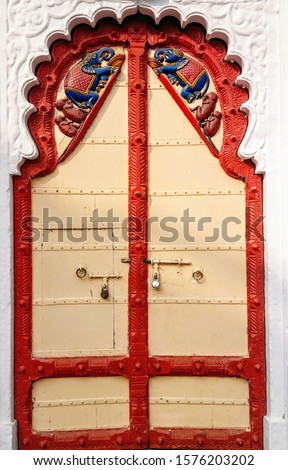 Vintage wooden Doors red yellow colour on it Elephant and Monkey mounting on the door
