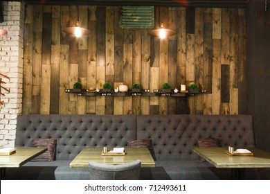 Vintage wooden loft interior of restaurant. Cozy dining place, contemporary design background