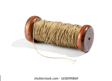 Vintage Wooden Reel With Brown Thread Or Twine On White With Shadow Lying On Its Side