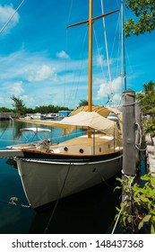 Vintage Wooden Sailboat Docked In A Florida Keys Marina.