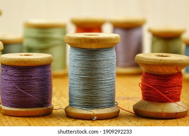 Vintage wooden spools of thread for sewing