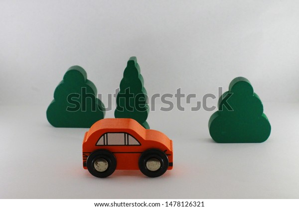 Vintage wooden toy orange\
vehicles