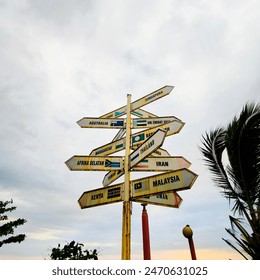 Vintage world country direction sign, evoking a sense of nostalgia and wanderlust, perfect for adding a touch of global flair to any decor, southeast asia, africa, asia,  - Powered by Shutterstock