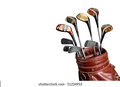 Vintage Worn Golf Clubs In An Old Bag Isolated Over A White Background With A Clipping Path