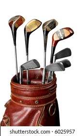 Vintage Worn Golf Clubs In An Old Bag Isolated Over A White Background With A Clipping Path