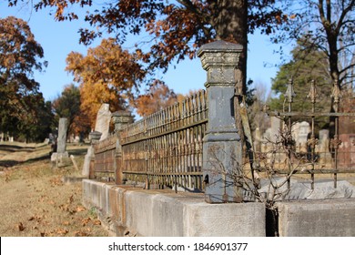 The Vintage Wrought Iron Corner Post And Fence Around A Family Burial Plot