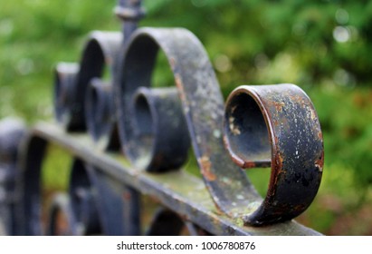 Vintage Wrought Iron Gate With Peeling Paint And Rust