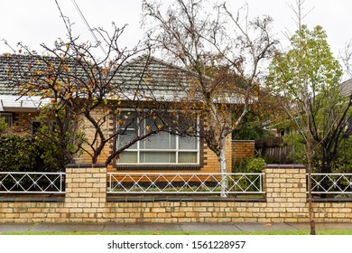 Vintage Yellow Brick House In Melbourne Suburbia.