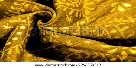 vintage yellow fabric with pale floral pattern useful for textures and backgrounds. Background texture
