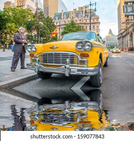 Vintage Yellow Taxi In New York Streets With Driver Waiting For Customers.