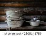 Vintage Zinc wash basins in a smoke sauna. Zinc wash basins on the smoke sauna bench. 