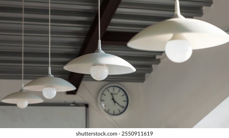 A vintagestyle clock, elegantly hanging from the ceiling of the room, clearly shows the time as precisely 420 in the afternoon hour