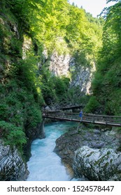 VINTGAR GORGE, SLOVENIA - JUNE 5, 2019: Tourists standing on the wooden path at the Vintgar Gorge, Slovenia
