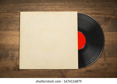 Vinyl Record With The Blank Cover On Wooden Desk