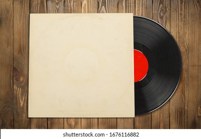 Vinyl record with the blank cover on wooden desk