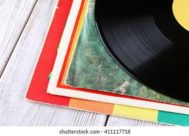 vinyl record lie in stack on table, vintage