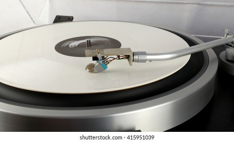 Vinyl record on a turntable record player 33rpm - Powered by Shutterstock