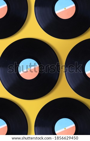 Vinyl record pattern on yellow background
