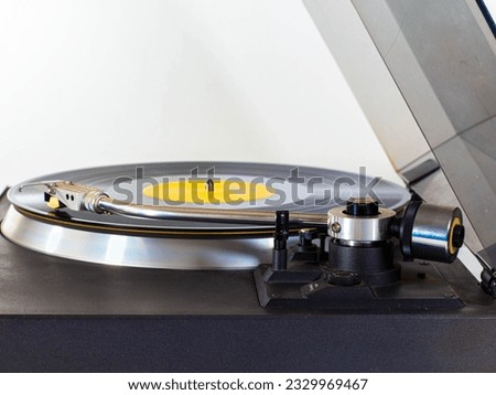 vinyl record player 80's automatic with cover and white background