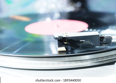 Vinyl record player, bright lights disco-bokeh. - Shutterstock ID 1893440050