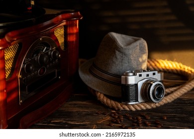 Vinyl Record Player. Old School Style Cinemagraph Loop Vinyl Record Player, Hat And Camera.  Old Style Gangster Look. Rotating Phonograph. Abstract Vintage Background.